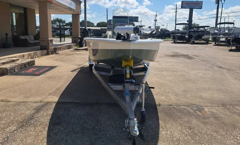 Slide: The Image of An Avid 21MAG ST boat from 2027 is on a trailer in a parking lot. - 5