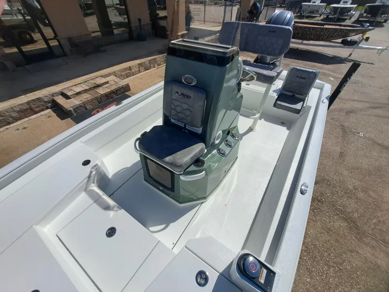 Slide: The Image of The image shows a 2027 Avid 21MAG ST boat with modern seating and a control console. - 22