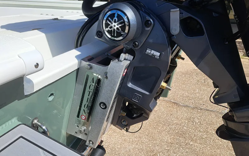 Slide: The Image of Close-up of a boat engine with controls and a brand logo. - 12