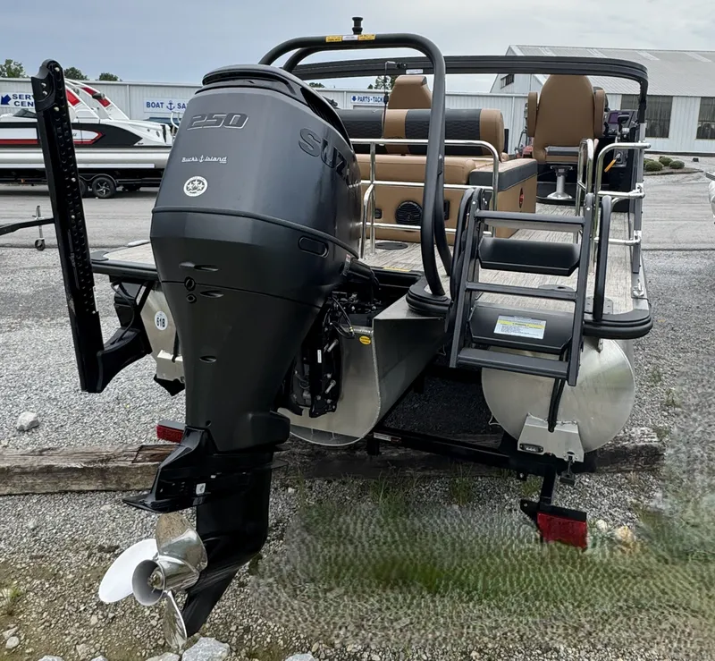 Slide: The Image of The image shows a 2026 Bentley Pontoons Elite 223 SwingBack DC with a Suzuki 250 engine. - 2