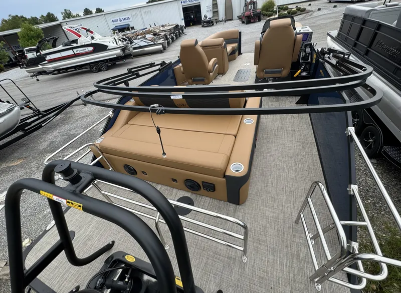 Slide: The Image of The image shows the deck of a 2026 Bentley Pontoons Elite 223 SwingBack DC with beige seating. - 7