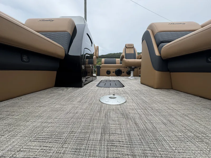 Slide: The Image of The image shows the interior of a 2026 Bentley Pontoons Elite 223 SwingBack DC with luxurious seating. - 8
