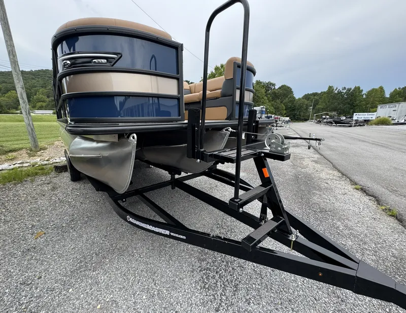 Slide: The Image of A 2026 Bentley Pontoons Elite 223 SwingBack DC on a trailer, ready for transport. - 16