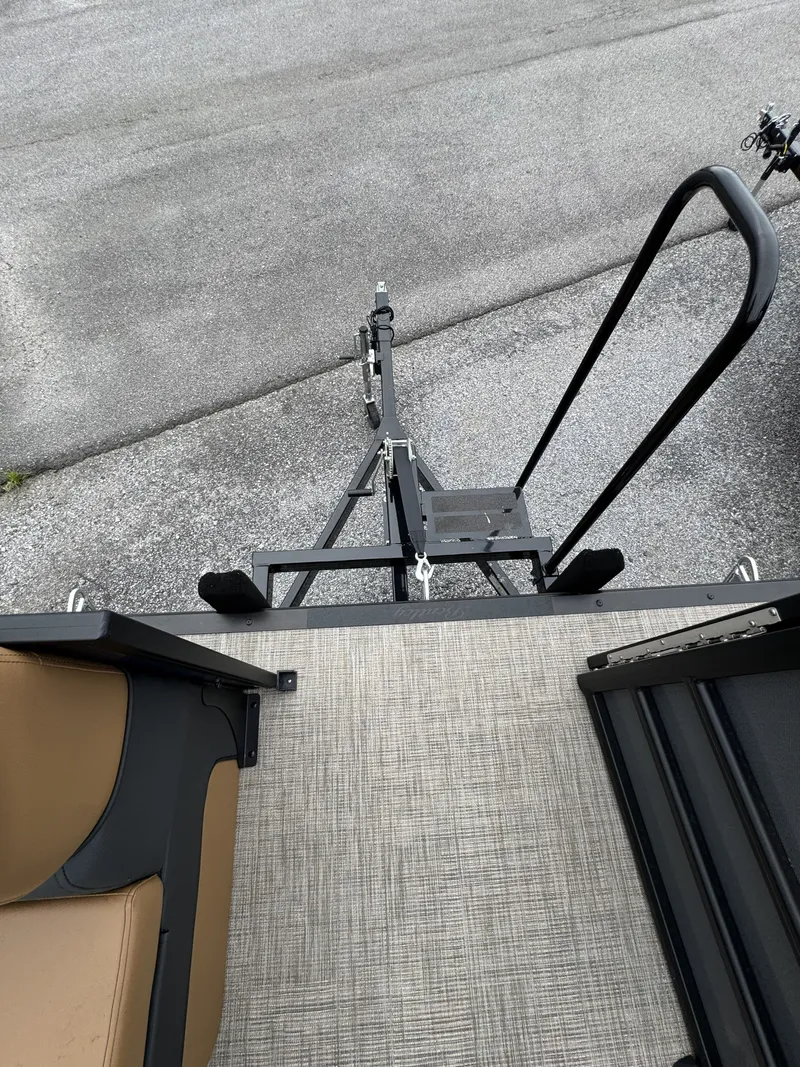Slide: The Image of View of a boat trailer with gray flooring and black railing. - 14