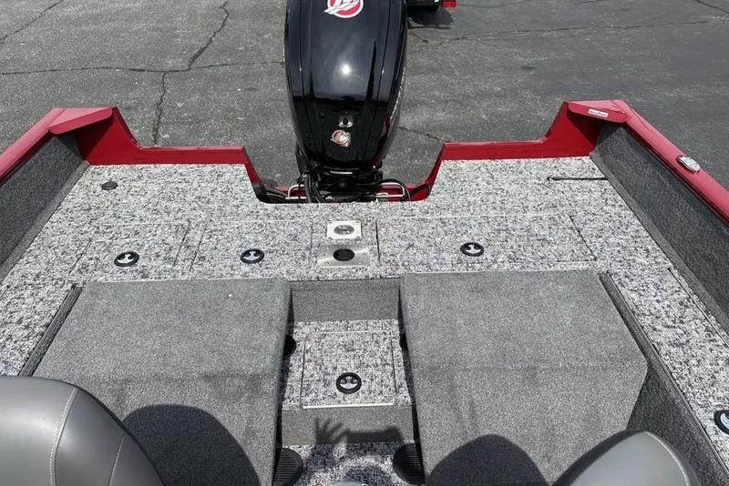 Slide: The Image of 2025 Tracker Pro Guide V-175 Combo boat interior with motor, featuring gray and red design. - 23