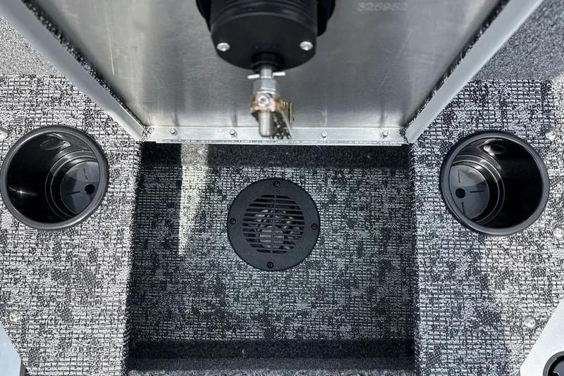Slide: The Image of Interior of 2025 Tracker Pro Guide V-175 Combo boat with cup holders and carpeted flooring. - 36