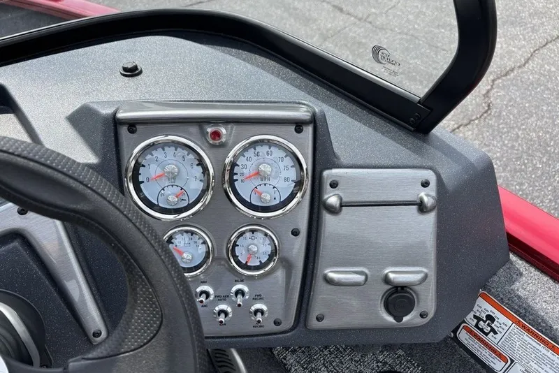 Slide: The Image of Dashboard of 2025 Tracker Pro Guide V-175 Combo boat with gauges and controls. - 17