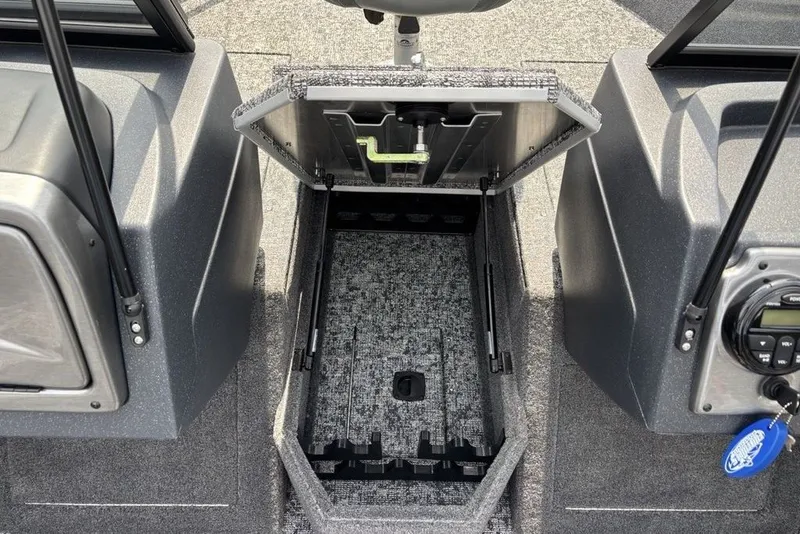 Slide: The Image of 2025 Tracker Pro Guide V-175 Combo boat storage compartment open, showcasing interior design. - 24