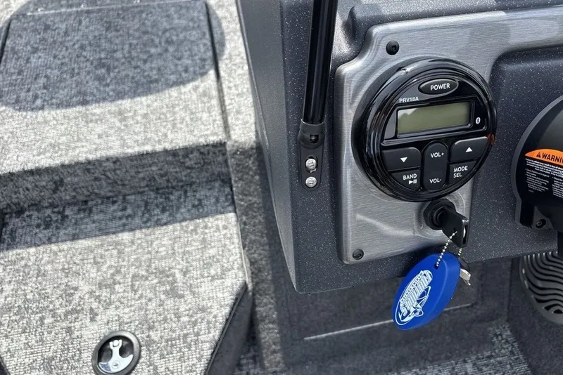 Slide: The Image of 2025 Tracker Pro Guide V-175 Combo dashboard with control panel and key fob. - 27