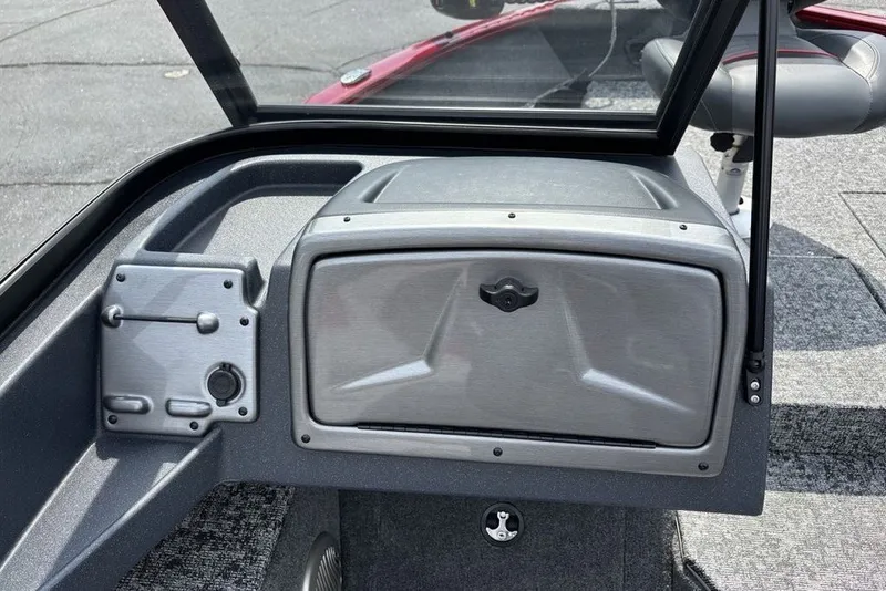 Slide: The Image of 2025 Tracker Pro Guide V-175 Combo boat dashboard with storage compartment and controls. - 29