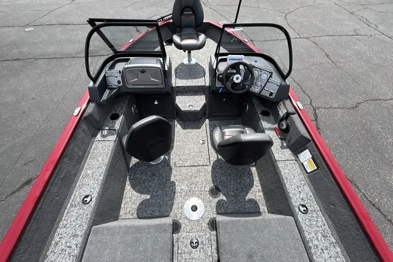 Slide: The Image of 2025 Tracker Pro Guide V-175 Combo boat interior with seating and steering console. - 38