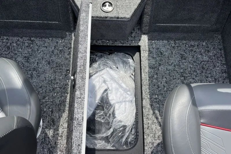Slide: The Image of Interior of 2025 Tracker Pro Guide V-175 Combo boat with storage compartment open. - 25