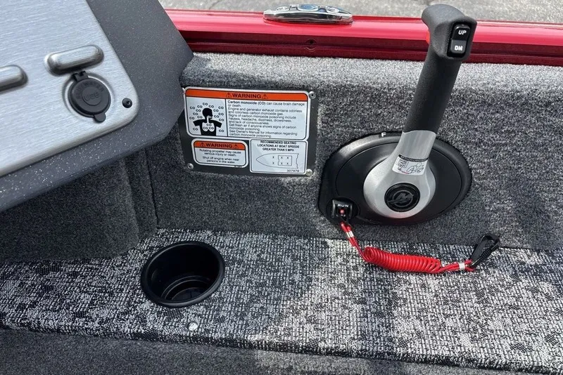 Slide: The Image of 2025 Tracker Pro Guide V-175 Combo boat control panel with throttle lever and safety warnings. - 22
