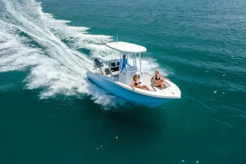 The Image of 2027 Tidewater 210 CC Adventure cruising on open water with passengers enjoying the ride. - 1