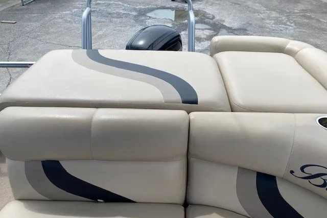 Slide: The Image of 2015 Bentley Pontoons 220 Cruise with beige seating and stylish wave design. - 10