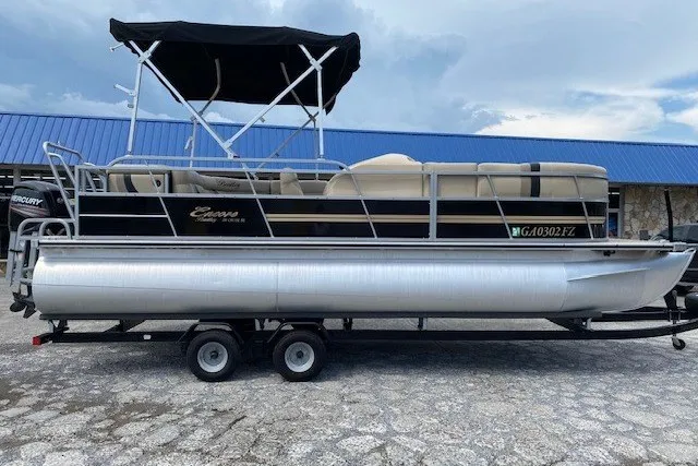 The Image of 2015 Bentley Pontoons 220 Cruise pontoon boat with canopy, parked on a trailer. - 1