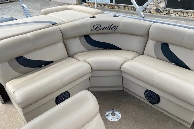Slide: The Image of 2015 Bentley Pontoons 220 Cruise interior with beige seating and stylish design. - 9