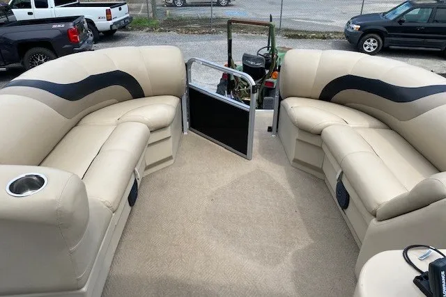 Slide: The Image of 2015 Bentley Pontoons 220 Cruise interior with beige seating and cup holders. - 7