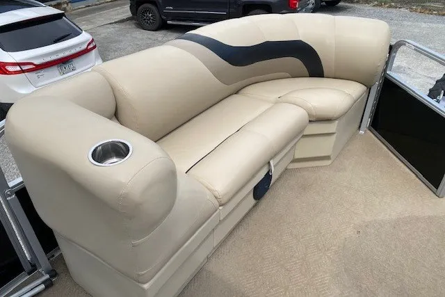 Slide: The Image of 2015 Bentley Pontoons 220 Cruise with beige seating and cup holder on deck. - 5