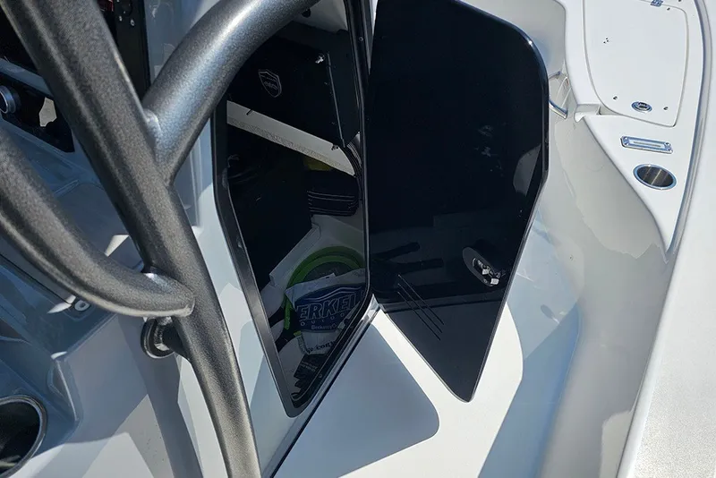 Slide: The Image of 2026 Sea Pro 250 Bay boat interior storage compartment with open door. - 29
