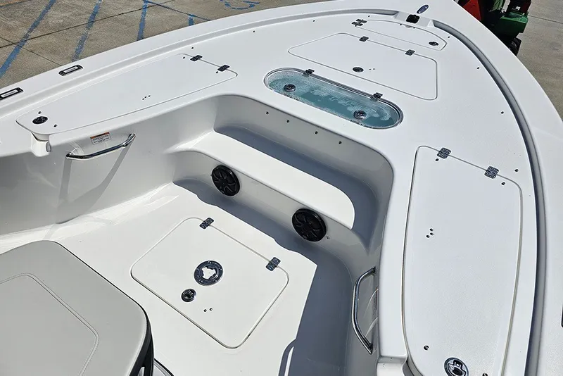 Slide: The Image of 2026 Sea Pro 250 Bay boat interior with storage compartments and seating. - 30