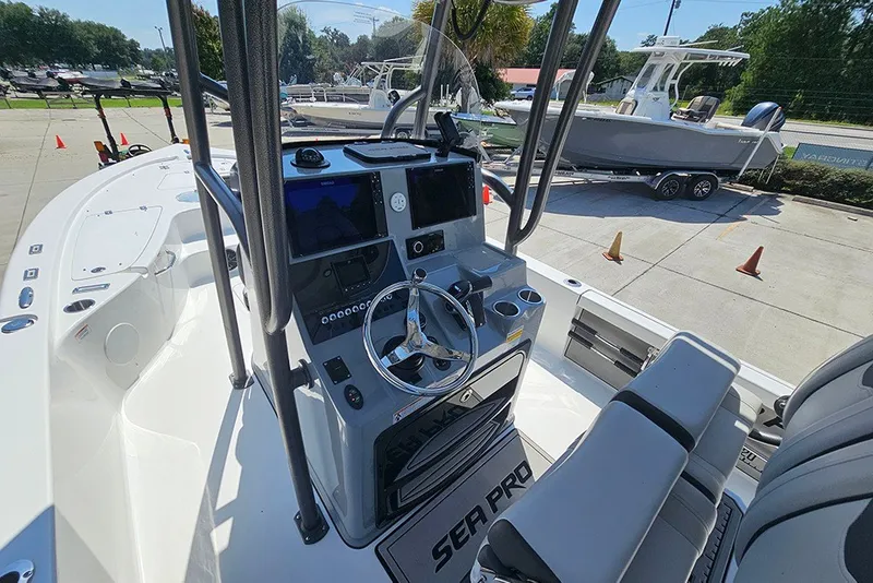 Slide: The Image of 2026 Sea Pro 250 Bay boat interior with steering console and navigation equipment. - 20
