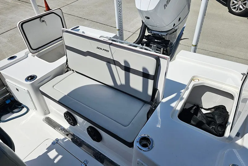 Slide: The Image of 2026 Sea Pro 250 Bay boat interior with storage compartments and seating. - 13