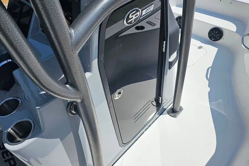 Slide: The Image of 2026 Sea Pro 250 Bay boat interior with console and storage door. - 28