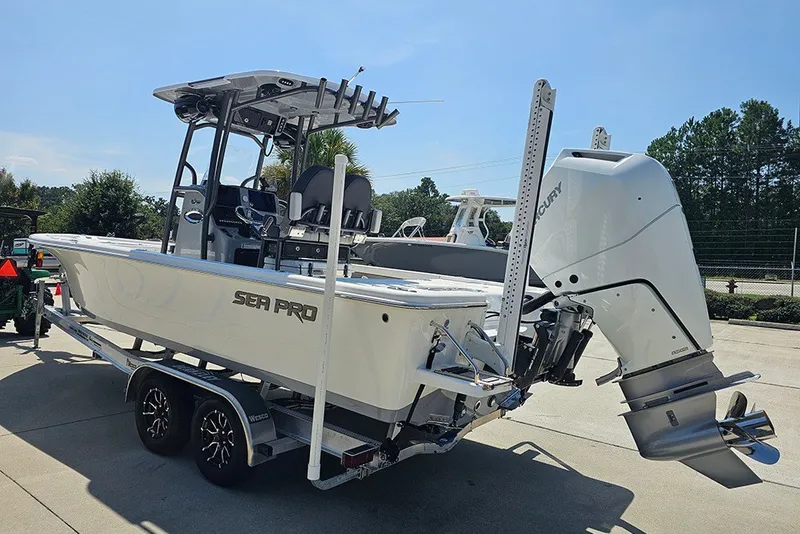 Slide: The Image of 2026 Sea Pro 250 Bay boat on trailer, featuring a powerful Mercury outboard motor. - 8