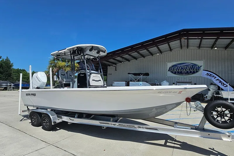 Slide: The Image of 2026 Sea Pro 250 Bay boat on trailer at Berkeley Outdoors dealership. - 2