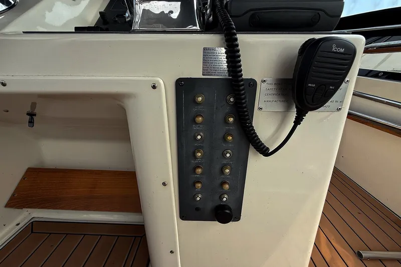 Slide: The Image of Control panel of a 1989 Tiara Yachts 3600 Convertible with radio and switches. - 23