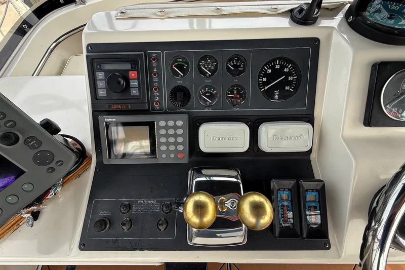Slide: The Image of Dashboard of a 1989 Tiara Yachts 3600 Convertible with navigation and control instruments. - 20