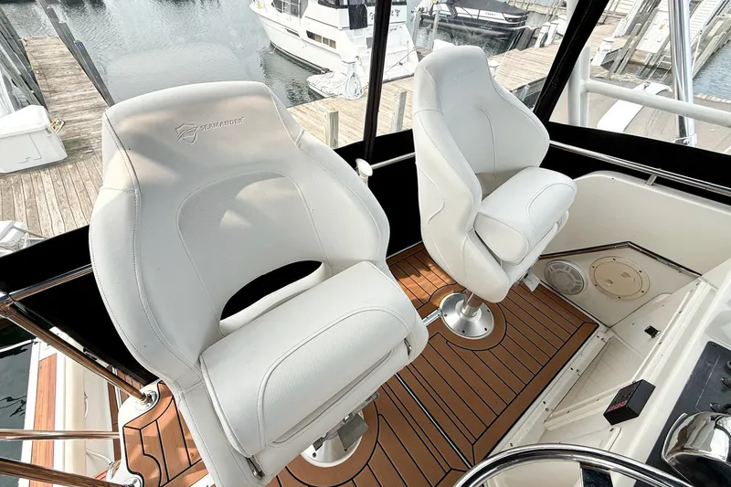 Slide: The Image of Captain's chairs on 1989 Tiara Yachts 3600 Convertible, docked at marina. - 16