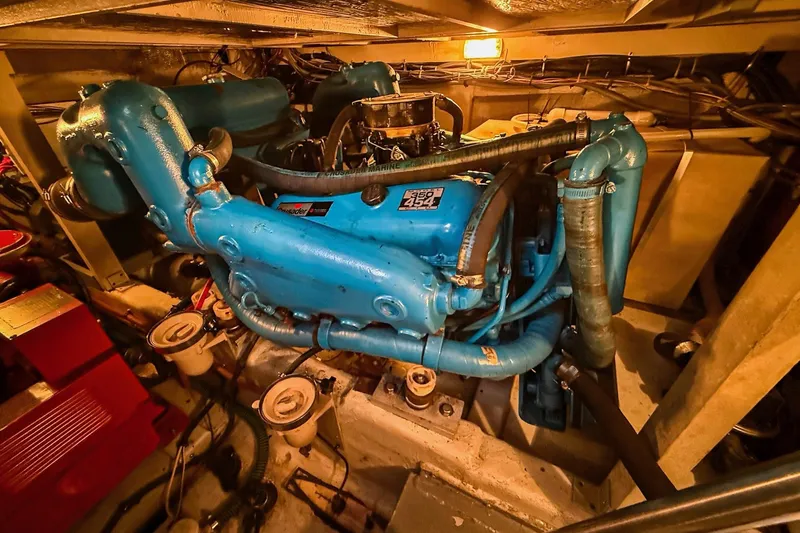 Slide: The Image of Engine room of 1989 Tiara Yachts 3600 Convertible with blue marine engine. - 48