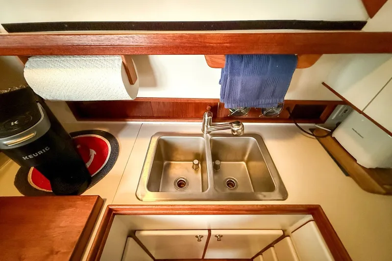 Slide: The Image of 1989 Tiara Yachts 3600 Convertible kitchen with sink, Keurig, and towel rack. - 35