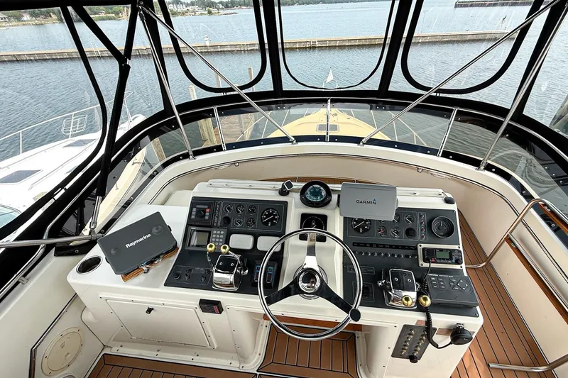 Slide: The Image of Cockpit of 1989 Tiara Yachts 3600 Convertible with navigation equipment and steering wheel. - 18