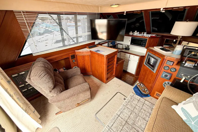 Slide: The Image of Interior of 1989 Tiara Yachts 3600 Convertible with cozy seating and modern amenities. - 32