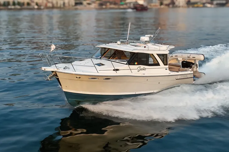 Slide: The Image of 2023 Cutwater C-30 Sedan cruising on water, showcasing sleek design and performance. - 16