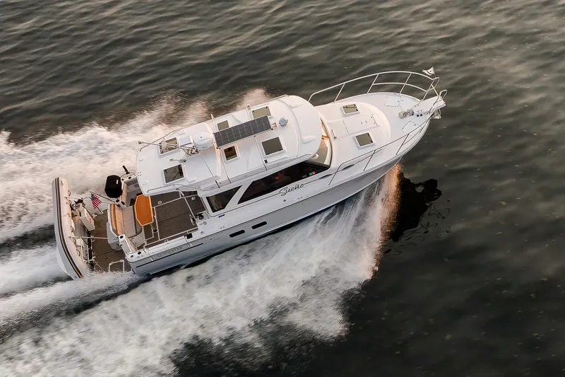 Slide: The Image of 2023 Cutwater C-30 Sedan cruising on water, aerial view. - 17