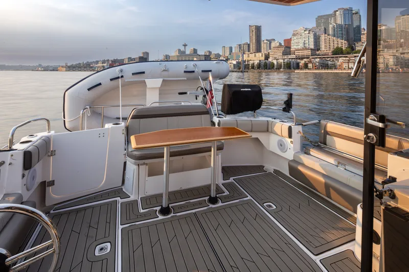 Slide: The Image of 2023 Cutwater C-30 Sedan boat interior with city skyline view. - 20