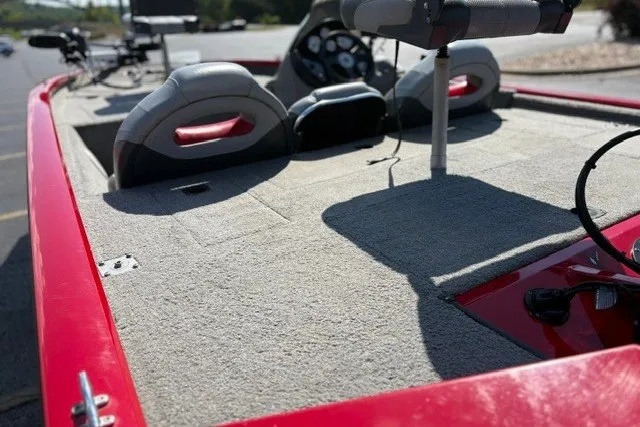 Slide: The Image of 2012 TRACKER BOATS Pro Team 175 interior with red trim and seating. - 61