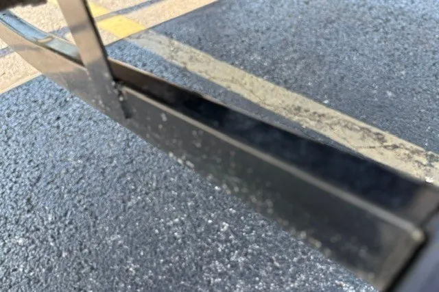 Slide: The Image of Close-up of a 2012 TRACKER BOATS Pro Team 175 trailer detail on asphalt. - 50