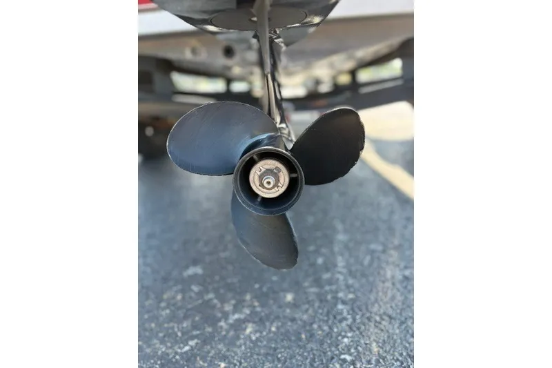 Slide: The Image of Propeller of 2012 TRACKER BOATS Pro Team 175 on pavement background. - 18