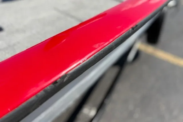 Slide: The Image of Close-up of a 2012 TRACKER BOATS Pro Team 175 with red detailing. - 43