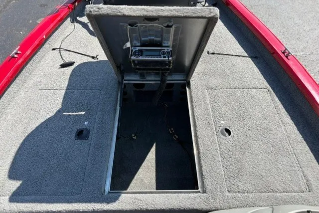 Slide: The Image of 2012 TRACKER BOATS Pro Team 175 deck with open storage compartment. - 20