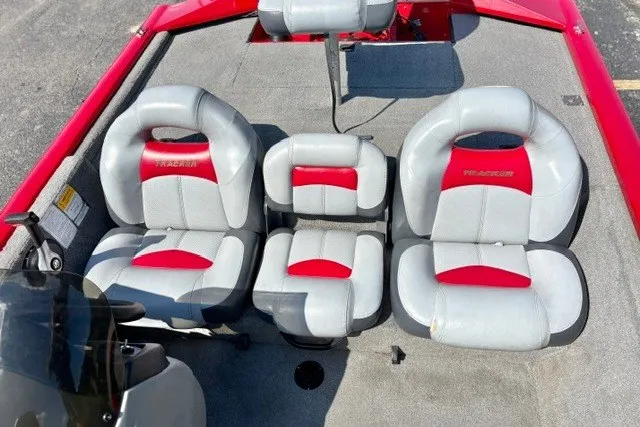 Slide: The Image of 2012 TRACKER BOATS Pro Team 175 interior with gray and red seating arrangement. - 31