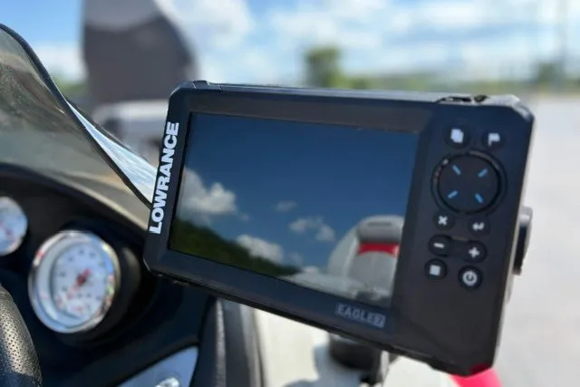 Slide: The Image of Lowrance fish finder on 2012 TRACKER BOATS Pro Team 175 dashboard, clear sky reflection. - 55
