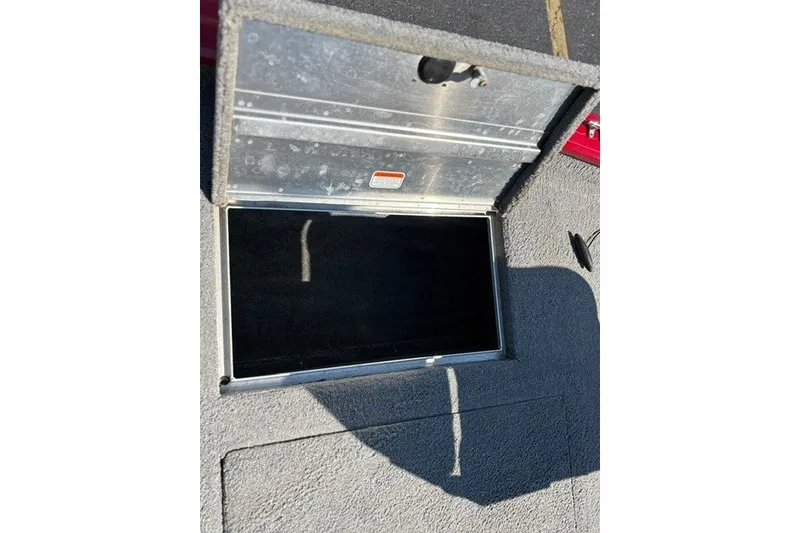 Slide: The Image of Open storage compartment on 2012 TRACKER BOATS Pro Team 175. - 17