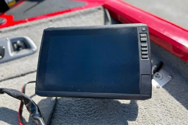 Slide: The Image of Fishfinder device on a 2012 TRACKER BOATS Pro Team 175, mounted on a carpeted surface. - 51