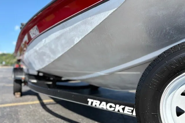 Slide: The Image of 2012 TRACKER BOATS Pro Team 175 on trailer, close-up view of hull and tire. - 35